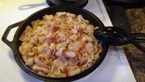 bacon cooking in a skillet