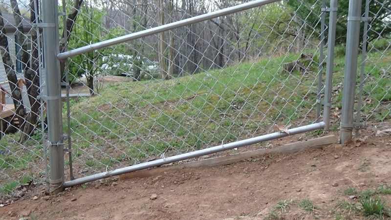 Of course what she's really miffed about is not the scolding but the fact that Doug was digging in and pinning down a landscape timber under the gate to thwart any further excavation.